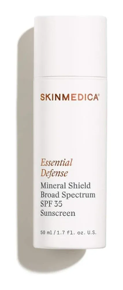 Slim white bottle with copper lettering